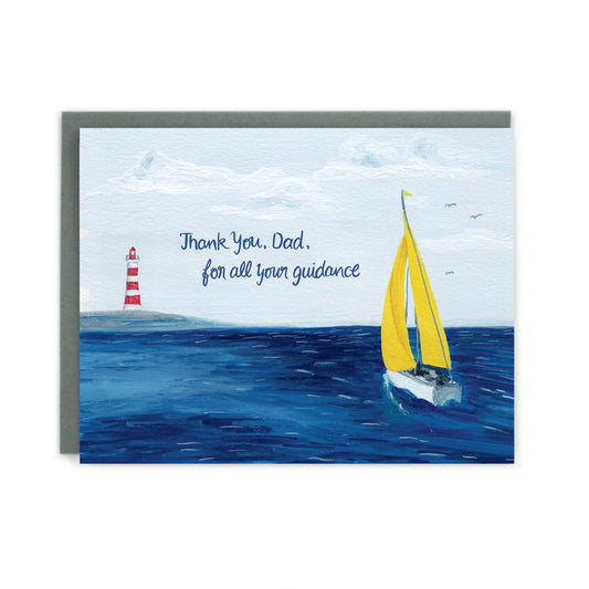 Made in Canada sailing themed Father's Day card, with hand drawn scene of a sailboat with yellow sails in the blue ocean heading towards a red and white lighthouse. Caption reads: Thank You, Dad, for all your guidance