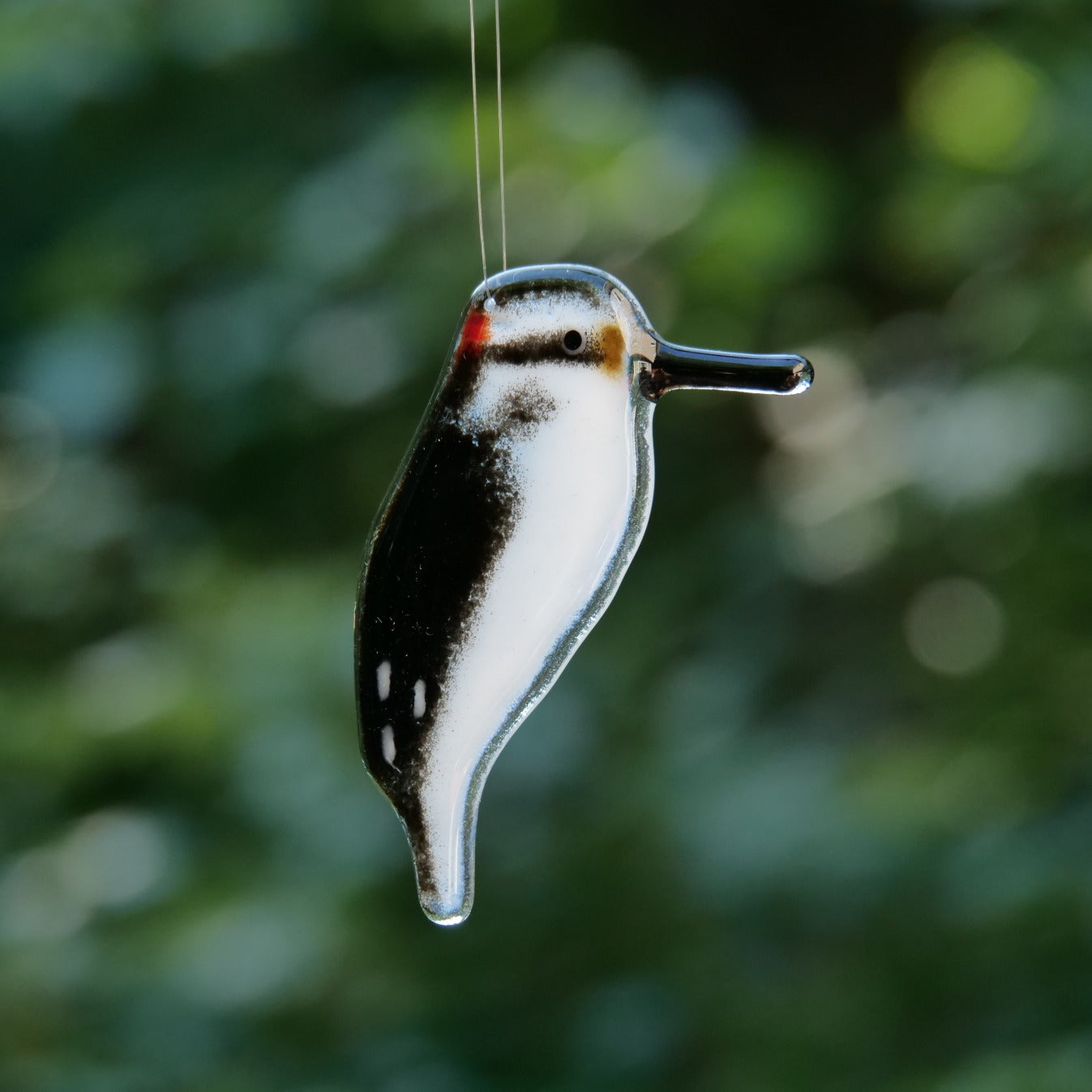 Glass woodpecker ornament handmade in Canada.