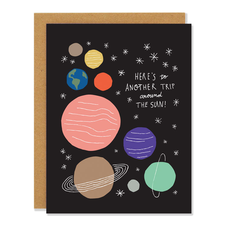 Made in Canada Birthday card with solar system design with nine planets and stars. Caption reads: Here's to another trip around the sun!