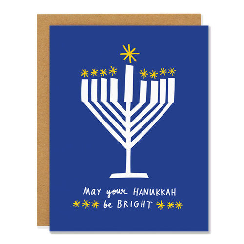 Made in Canada Hanukkah card with a white menorah on a blue background. Caption reads: May your Hanukkah be bright.