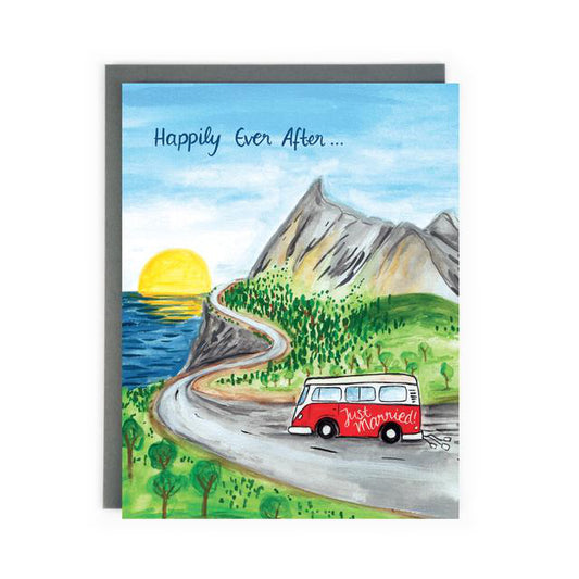 Made in Canada wedding card with hand drawn scene of a vintage Volkswagen Camper Van with Just Married written on the side, driving up a windy coastal road into the sunset. Caption reads: Happily Ever After