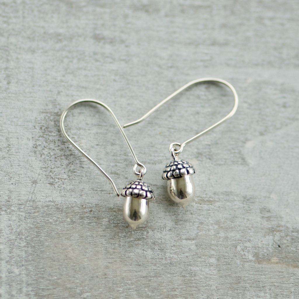 Made in Canada Justine Brooks tiny silver acorn drop earrings.