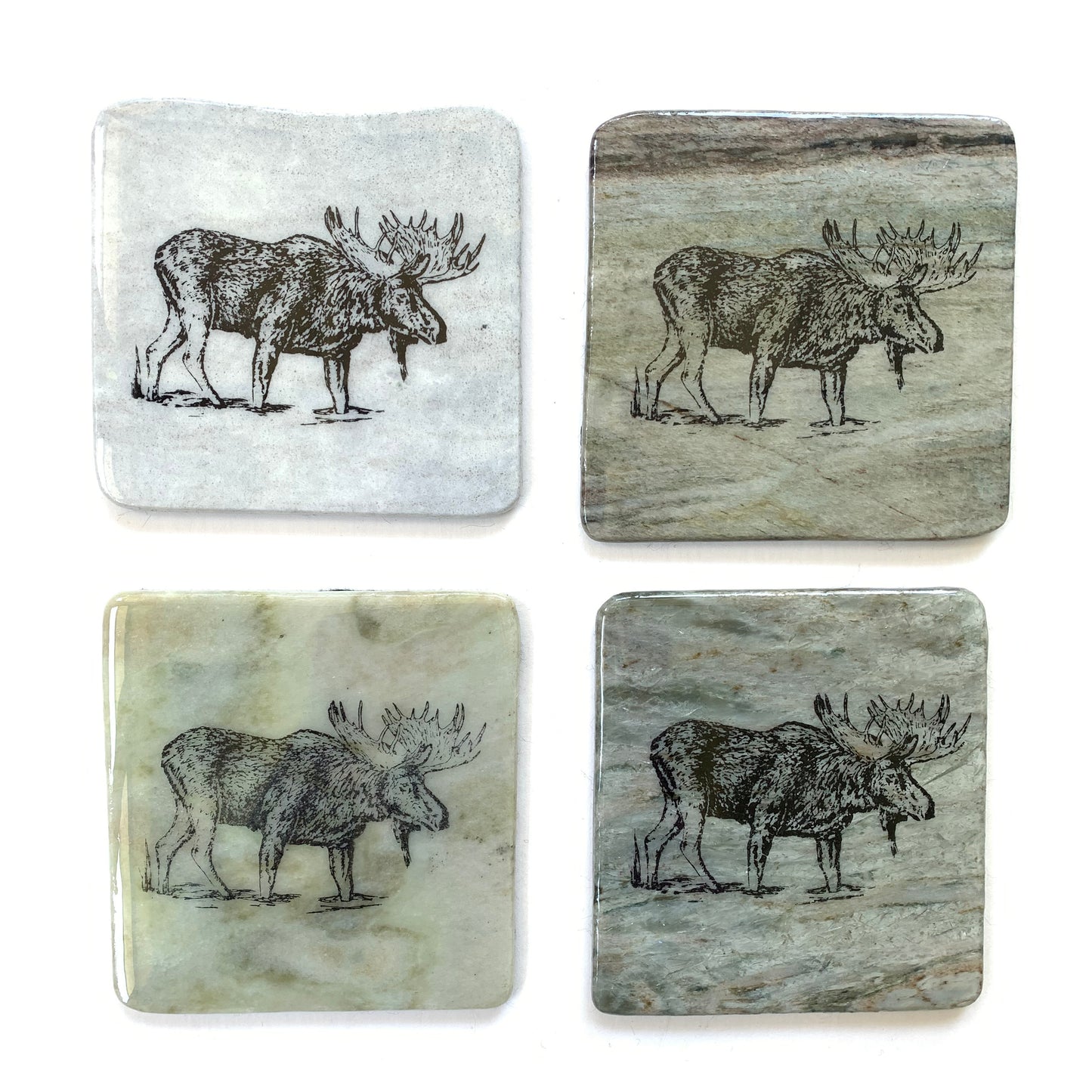 Various granite coasters with moose design made in Canada.