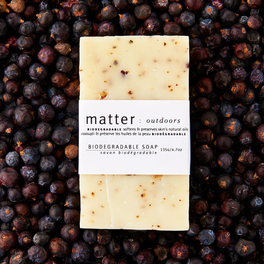 Made in Canada biodegradable soap by Matter Outdoors on a bed of dried juniper berries.
