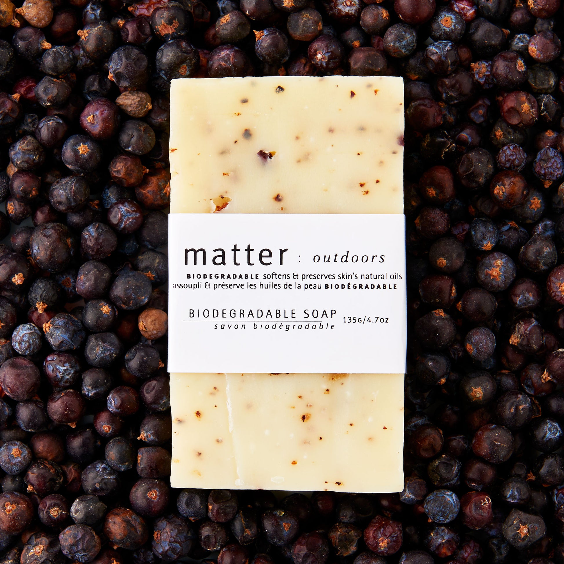 Made in Canada biodegradable soap by Matter Outdoors on a bed of dried juniper berries.