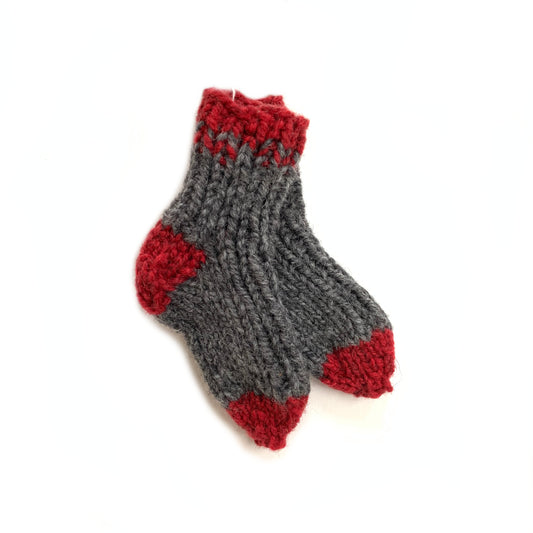 Hand knit red and grey wool baby socks, made in Canada.