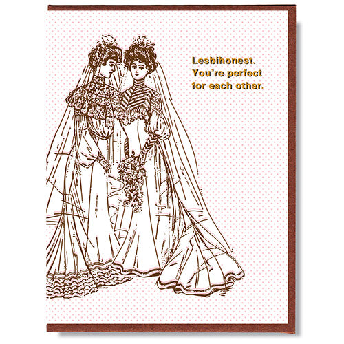 Made in Canada wedding card for lesbian couple, with drawing of two women wearing wedding dresses. Caption reads: Lesbihonest. You're perfect for each other.