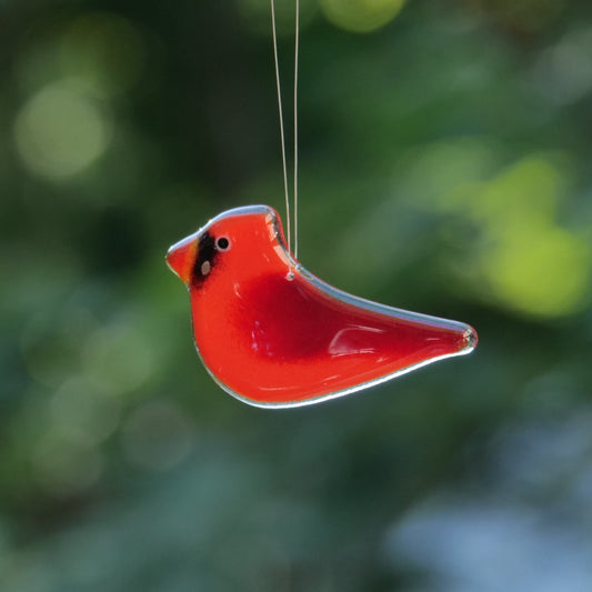 Glass cardinal ornament handmade in Canada.