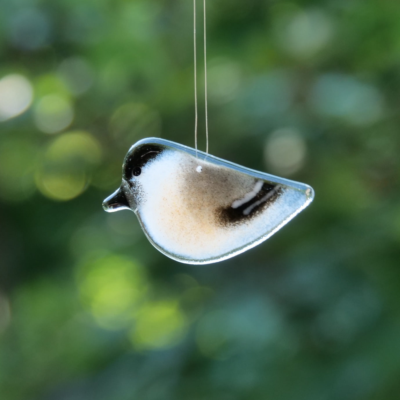 Glass chickadee ornament handmade in Canada.