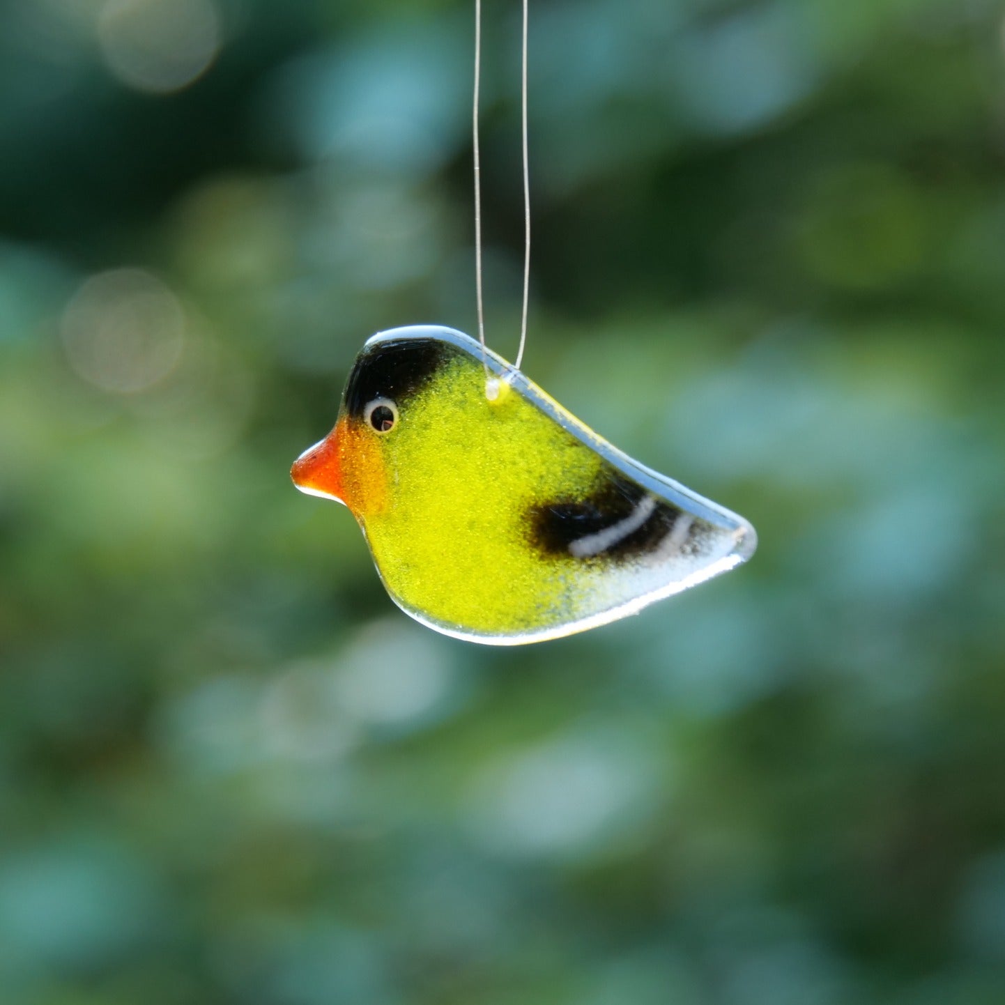 Glass goldfinch ornament handmade in Canada.