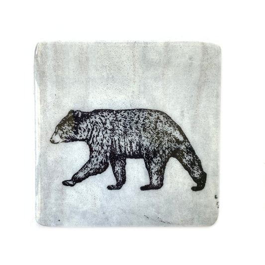 Made in Canada granite coaster with black bear design.